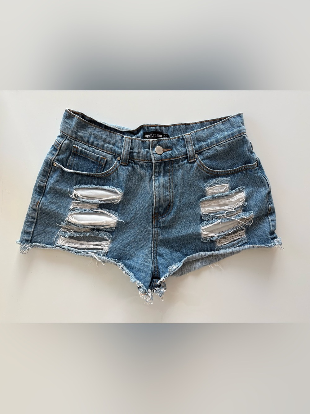 PrettyLittleThing Light Blue Ripped Denim Shorts
